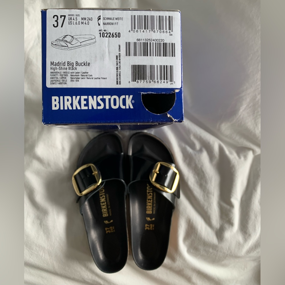Birkenstock Madrid Big Buckle one-strap sandal in High Shine Black.